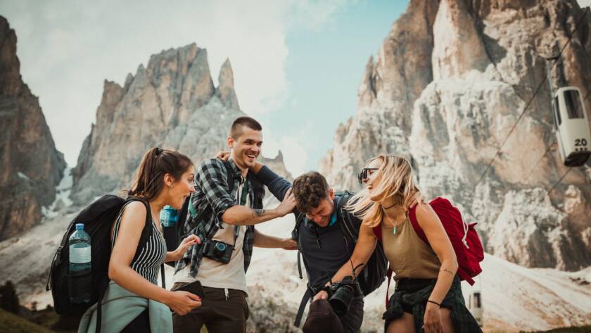 low-angle photography of two men playing beside two women